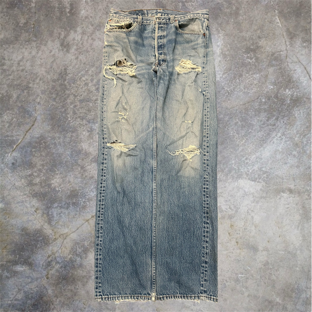 Vintage Levi's 501 Button Fly Distressed Light Wash Jeans Made in USA